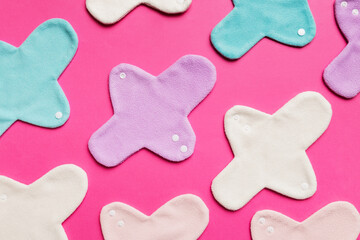 Obraz premium Eco-friendly reusable fabric women's pads. set of colorful bright reusable menstrual pads. zero waste woman periods concept top view with copy space