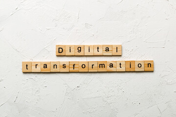 digital transformation word written on wood block. digital transformation text on cement table for your desing, concept