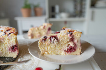 Piece of delicious cheery cheesecake on a plate 