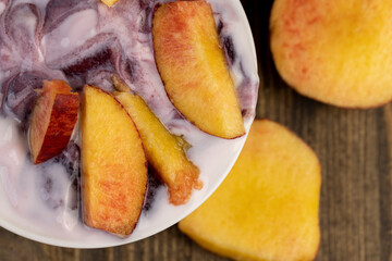 natural yogurt in a white bowl with fruits