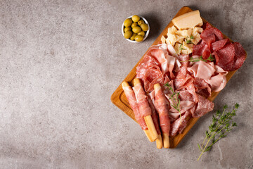 Charcuterie board. Antipasti appetizers of meat platter with salami, prosciutto crudo or jamon and olives.