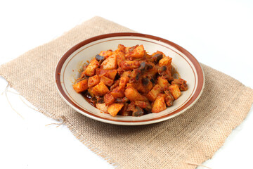Sambal Goreng Ati Kentang, javanese (Indonesia) traditional food. Served in plate. Copy space.fried potatoes cooked with chili and chickens liver