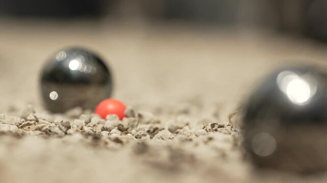 game of petanque sport with balls in Provence in close up and slowmotion