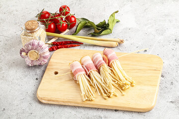 Raw Enoki mushroom with bacon