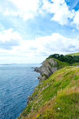 Jurassic coast view in Dorset near Lulworth Cove. Lulworth Cove cliffs view on a way to Durdle Door. The Jurassic Coast is a World Heritage Site on the English Channel coast of southern England.Dorset