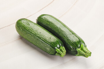 Raw green ripe zucchini vegetable