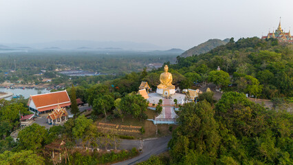Aerial view of beautiful Thang Sai temple, the temple is on a mountain surrounded by green forests.