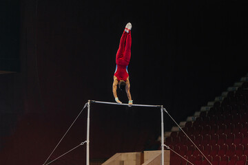 gymnast exercise horizontal bar in championship gymnastics, element long hang swings