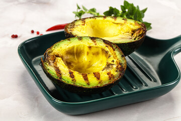 Sliced fresh avocado on the grill