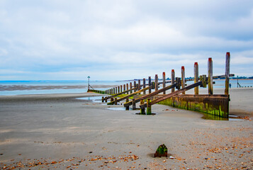 West Wittering UK beach wooden groynes