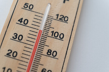 Thermometer on a light surface, indicating high temperature. Global warming.
