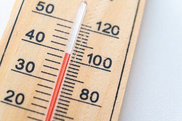 Thermometer on a light surface, indicating high temperature. Global warming.
