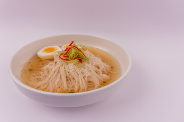 wide shot of a vermicelli soup on a white blank background