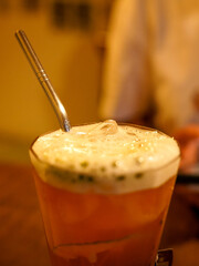 A special coffee that is cool and delicious covered with cream