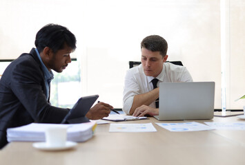 Obraz premium Business meeting, group of business executives meeting to discuss planning the collaboration of people in the company. Teamwork meeting business people in office workplace.