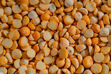 top shot close up yellow peas close-up lies on black and blue background Ukrainian culture, light protein food vegetarianism green crops fruits of the fields