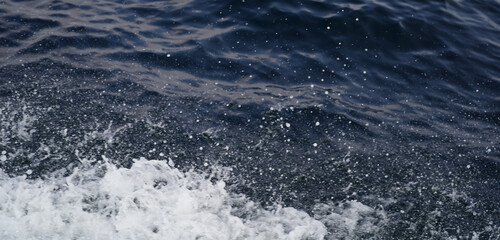 Blue sea water surface texture background with ripples