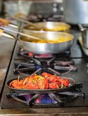 Cooking in a restaurant kitchen on a gas stove 