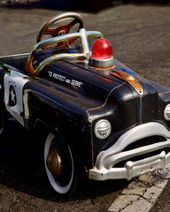 antique metal toy car with a Police theme © Heidi Patricola