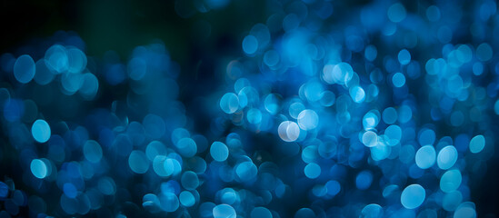 abstract blue background with bokeh effect; simple bold one color christmas holiday texture; widescreen backdrop