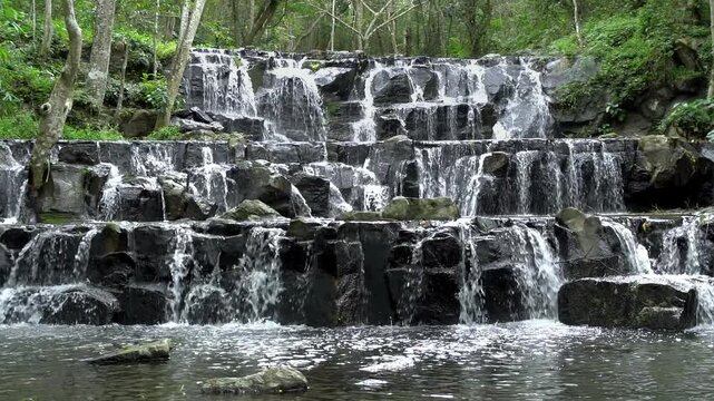 Beautiful waterfall in tropical forest at Namtok Samlan National Park, Saraburi, Thailand - Slow Motion