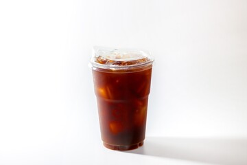 Americano ice coffee and coffee beans spread over glass put on white background with isolated style.