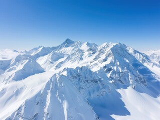 Fototapeta premium Snow-capped mountains under clear blue sky, panoramic view, high angle, pristine and untouched, crisp and cold atmosphere, rugged landscape