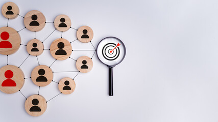 Wooden block with target icon linked with human icons for customer focus group, Customer...