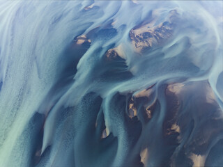 View from above, stunning patterns created in the volcanic sands of Iceland. As glaciers melt the water flows as rivers out to sea. Natural pattern, background, wallpaper.