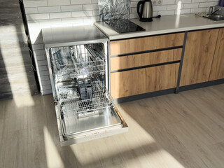 Built-in dishwasher with open door in kitchen
