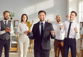 Happy businessman awarded prize for victory, business leader success, winning team celebrating in...