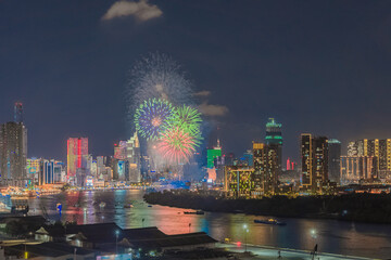 Celebration. Aerial view of fireworks lighting up the commercial district sky in Ho Chi Minh City (Saigon), Vietnam. Beautiful cityscape at night. Holidays, Independence Day, New Year