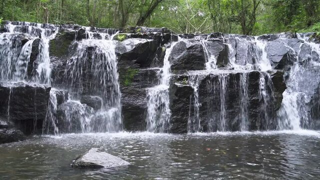 Beautiful waterfall cliff in tropical forest at Namtok Samlan National Park, Saraburi, Thailand