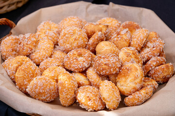 Puff pastries, round sugar-coated sugar puffs, golden crispy baked sweets, traditional French...