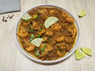 Udang bumbu balado. Shrimp with spicy chili sauce. Traditional cuisine from West Sumatra, Indonesia. Perfect for recipe, article, catalogue, or any cooking contents.