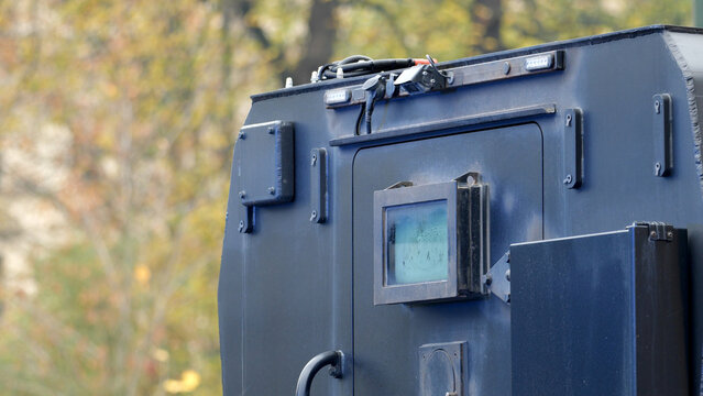 Generic heavy armored police vehicle closed locked back door, doors closeup, prisoners or money transport jail truck detail closeup shot, nobody, no people. Anti-terrorist vehicles equipment concept
