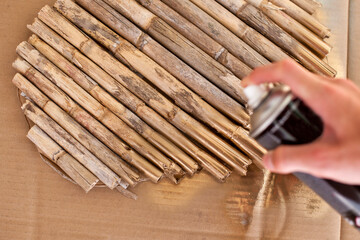 Step by step. How to create a heart shape wall decoration from the reed. Step 6 from 11.