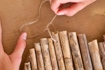 Step by step. How to create a heart shape wall decoration from the reed. Step 8 from 11.