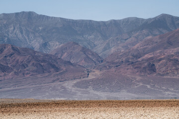 The mountains are covered in snow and the sky is clear