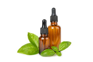 Basil essential oil isolated on white background. Basil essential oil and fresh leaves. Aromatherapy. Aroma oil. Medical herbs. Alternative medicine. Place for text. Copy space.