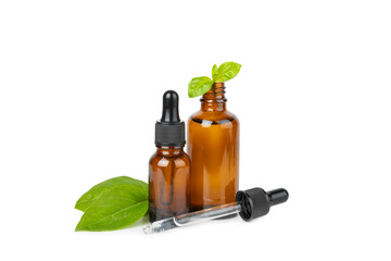 Basil essential oil isolated on white background. Basil essential oil and fresh leaves. Aromatherapy. Aroma oil. Medical herbs. Alternative medicine. Place for text. Copy space.