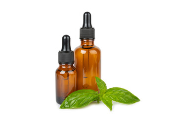 Basil essential oil isolated on white background. Basil essential oil and fresh leaves. Aromatherapy. Aroma oil. Medical herbs. Alternative medicine. Place for text. Copy space.