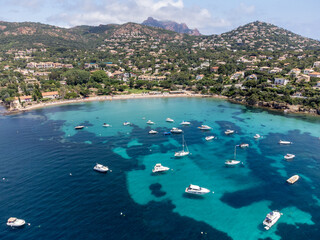 Panoramic view from above on blue Mediterranean dea, sandy beach of Agay town, summer vacation destination near Esterel mountains, French Riviera, Provence. France