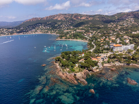 Panoramic view from above on blue Mediterranean dea, sandy beach of Agay town, summer vacation destination near Esterel mountains, French Riviera, Provence. France