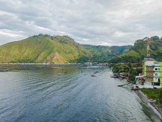 Aerial drone view of small town by  Toba Lake side at Haranggaol in Simalungun, Sumatra Utara, Indonesia