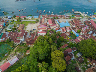 Aerial drone view of small town by  Toba Lake side at Haranggaol in Simalungun, Sumatra Utara, Indonesia