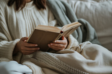 Cozy Relaxation Time at Home with a Good Book and Warm Blanket