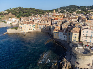 Fototapeta premium Aerial view on bays, beaches, old colorful houses of famous Saint-Tropez town on French Riviera, Var, Provence, France, summer vacation destination
