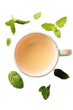 A refreshing cup of herbal tea with mint leaves, perfect for relaxation and wellness. Embrace a moment of calm with this soothing beverage.