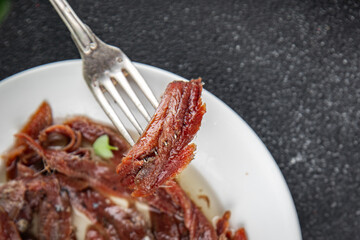anchovies in a plate on the table canned fish in oil fresh and tasty seafood meal food snack on the table copy space food background rustic